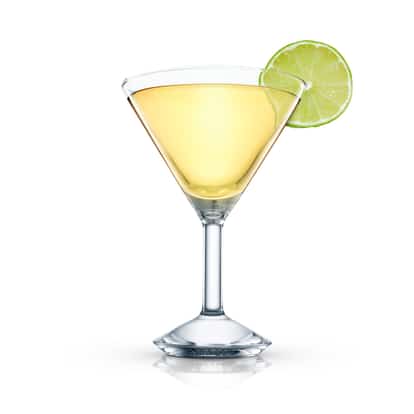 Corkscrew in a martini glass with a lime wheel on white background