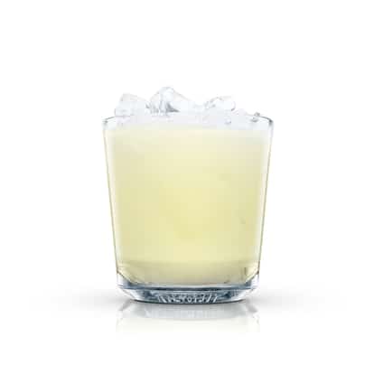 Cream Fizz served in an Absolut rocks glass filled with ice on white background