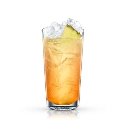 Cuba Ice Tea in a highball glass topped with crushed ice and a pineapple wedge