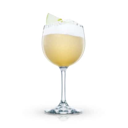Delicious Sour in a stemmed wine glass with foam layer and apple slice garnish on white background