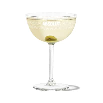 Dirty Vodka Martini in a coupe with olive garnish, Absolut logo on the glass.