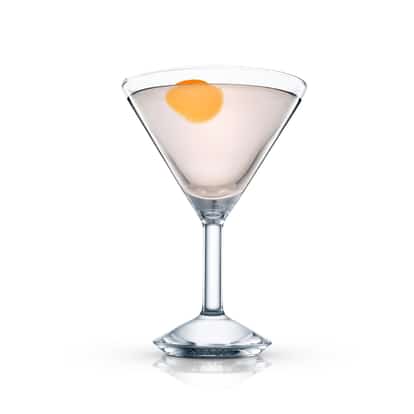 Dolly O’dare in a martini glass with an orange peel garnish on white background