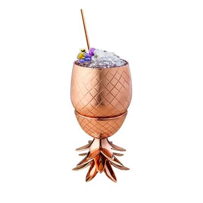Raspberry Beret served in a pineapple-shaped metal cup topped with crushed ice, edible flowers and a straw