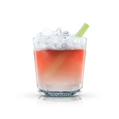 Errol Flynn’s Pick-me-up in an Absolut rocks glass with crushed ice and a celery stalk on white background
