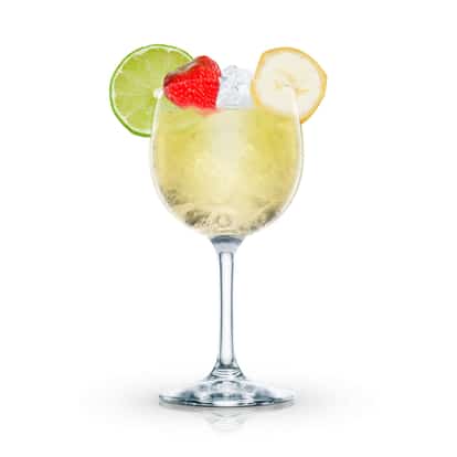 Europa Cup in a stemmed wine glass with ice and a lime wheel, strawberry and banana slice on white background