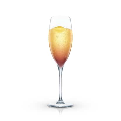 Fanny Hill in a champagne flute with an orange peel garnish on white background