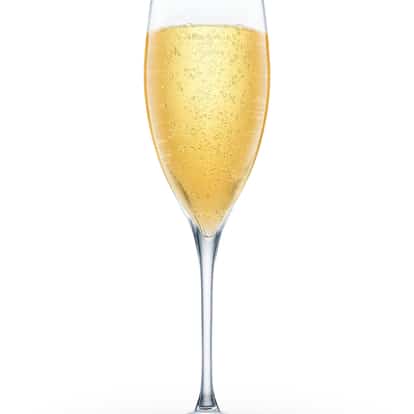 French 76 cocktails served in champagne glass made with Absolut Vodka.