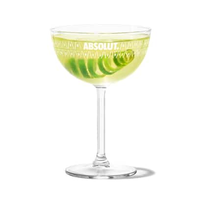 Gimlet in an Absolut coupe glass with a lime spiral
