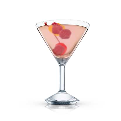 Glory Cocktail in a martini glass with a raspberry skewer and a citrus twist on white background