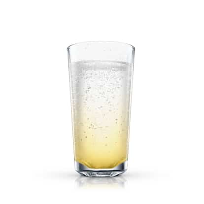 Golden Fizz in a highball glass with a golden layer at the base on white background