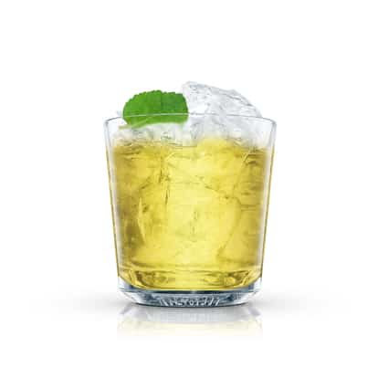 Golden Frog served in an Absolut rocks glass with crushed ice and mint leaf on white background