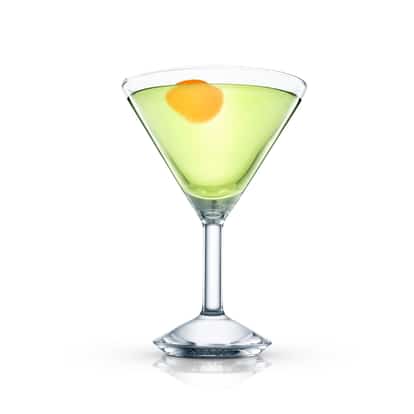 Green cocktail in an Absolut martini glass with an orange peel garnish on white background.