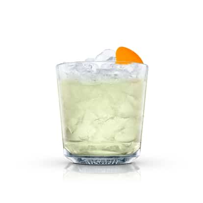Green Fizz in an Absolut rocks glass with crushed ice and an orange slice on white background