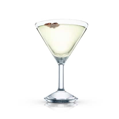 Greta Garbo cocktail in a stemmed martini glass with a small dried brown garnish on white background.