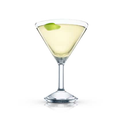 Hong Kong Cooler in a martini glass with a lime peel garnish on white background