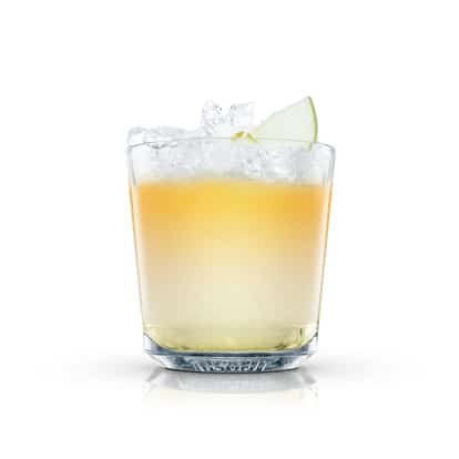 Hong Kong High Flyer in an Absolut rocks glass with crushed ice and an apple wedge on white background