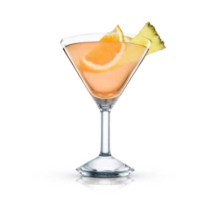 Honolulu One in a martini glass with an orange slice and pineapple wedge on white background