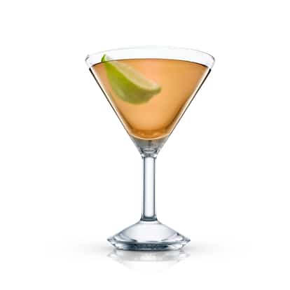 Ignorance Is Bliss in a martini glass with a lime wedge on white background