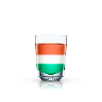 Italian Flag layered in a shot glass on white background
