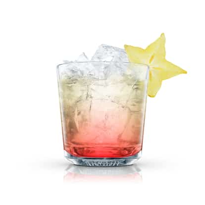 Juniper Breeze cocktail in an Absolut rocks glass with crushed ice and a starfruit slice on white background.