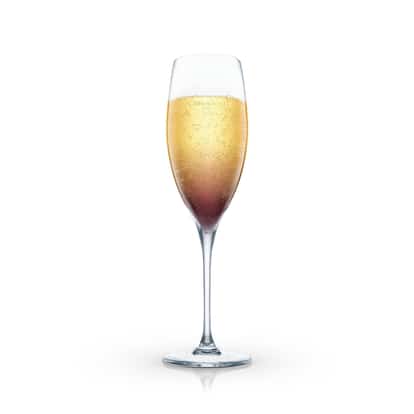 Kir Imperial in a champagne flute with a layered liqueur at the base on white background