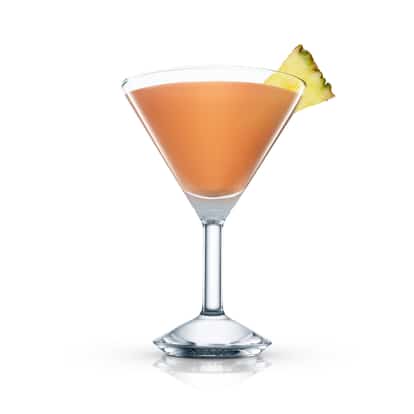 Ladies Cocktail in a martini glass with a pineapple wedge on white background