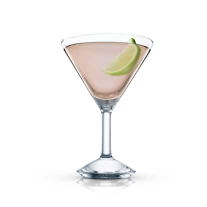 Clear pink cocktail with a lime wedge in an Absolut martini glass on white background.