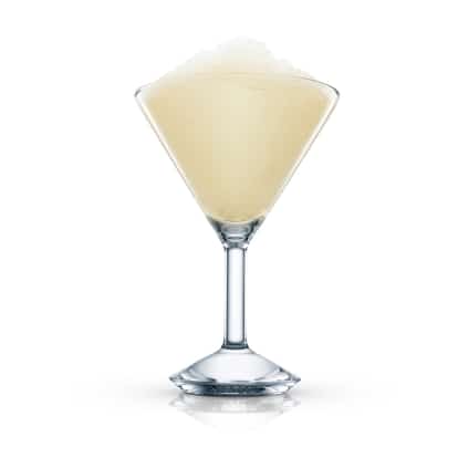 Lemon Chiffon Pie served frozen in a martini glass topped with crushed ice on white background