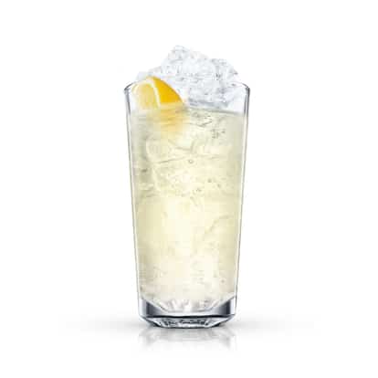 Lemongrad in a highball glass with ice and a lemon wedge on white background