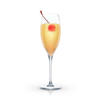 Leo’s Special in a champagne flute with a maraschino cherry on white background.