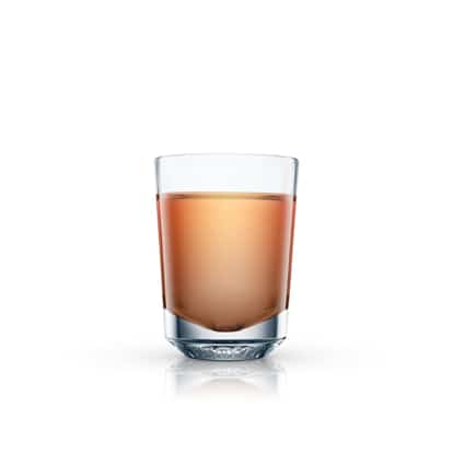 Lighthouse served in a rocks glass with reflection on white background