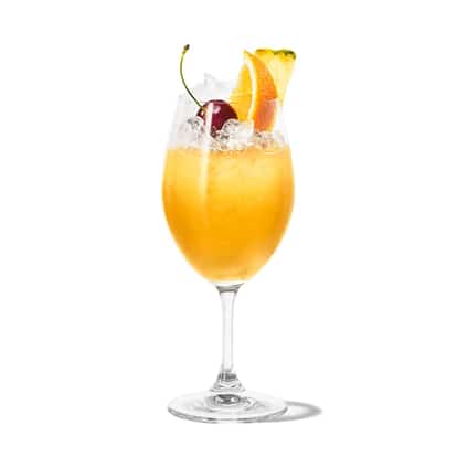 Mai-tai Special in a wine glass with crushed ice and a cherry and an orange wedge and a pineapple wedge