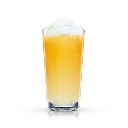 Malibu and Applejuice in a highball glass with crushed ice and an apple wedge on white background