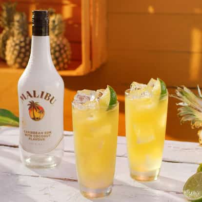 Malibu Pineapple next to a bottle of Malibu Rum