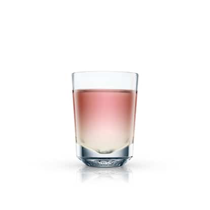 Malibu Bajan Congaline in a shot glass with layered liquids on white background