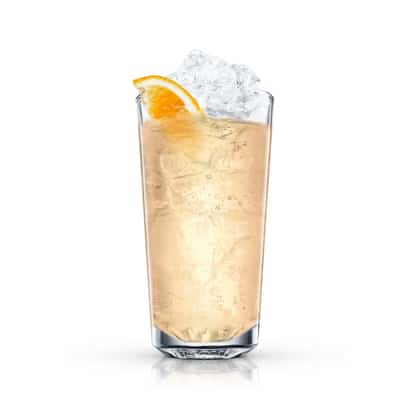 Malibu Cropover Iced Tea in a highball glass with crushed ice and an orange wedge on white background
