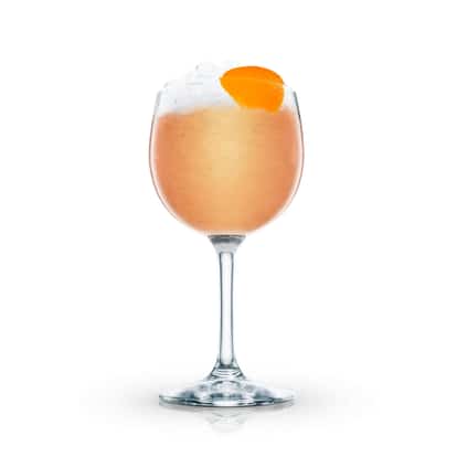 Gold Cup in a stemmed wine glass with crushed ice and an orange peel on white background.