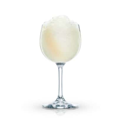 Mango Delight served in a stemmed wine glass with crushed ice on white background
