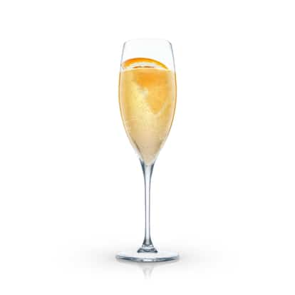 Moulin Rouge in a champagne flute with an orange slice on white background