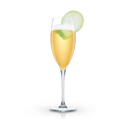 Golden cocktail in a champagne flute with apple slice garnish on white background.