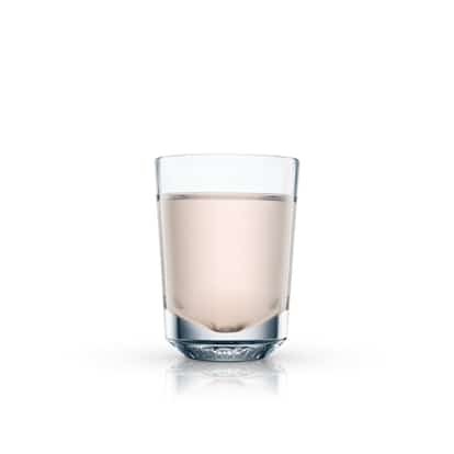 Peck in a rocks glass on white background