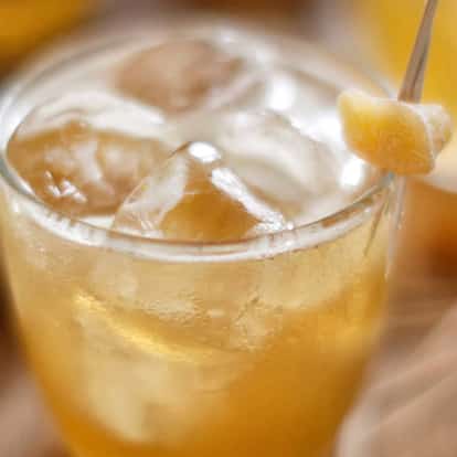 Penicillin in a rocks glass with ice and a candied ginger skewer