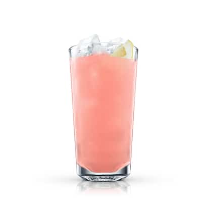Pink Grapefruit Fizz in a highball glass with ice and a lemon wedge on white background