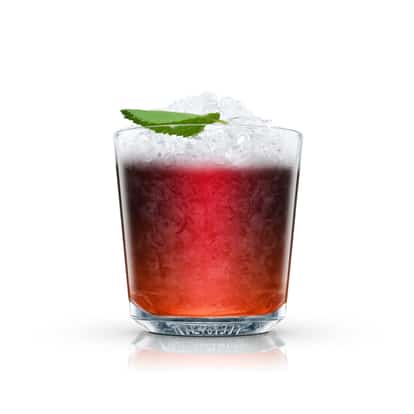 Port Cobbler in an Absolut rocks glass with crushed ice and a mint leaf on white background