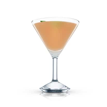 Ramona Cocktail in a martini glass with a mint leaf garnish on white background
