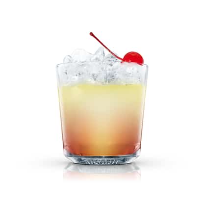 Redcoat served in an Absolut rocks glass with crushed ice and a maraschino cherry on white background