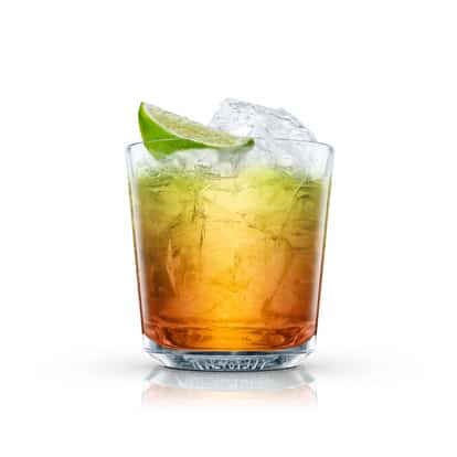Rum Gimlet in an Absolut rocks glass with crushed ice and a lime wedge on white background