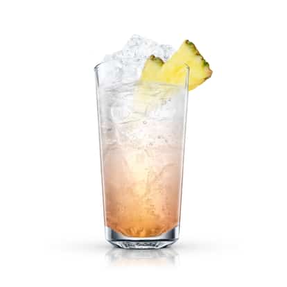 Rum Squirt in a highball glass with ice and a pineapple wedge on white background