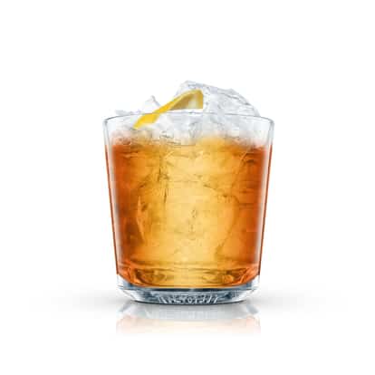 Rusty Nail in an Absolut rocks glass with crushed ice and a lemon twist on white background