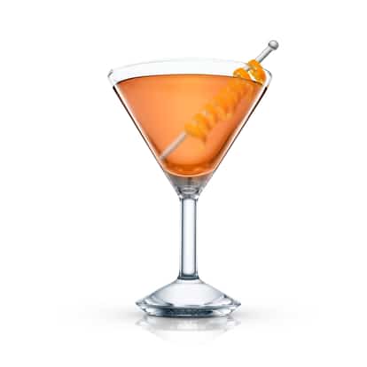 Rye Crusta in a martini glass with a spiral orange peel on a metal pick on white background
